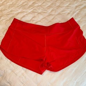 LULULEMON SPEED UP SHORT 2.5” red/orange